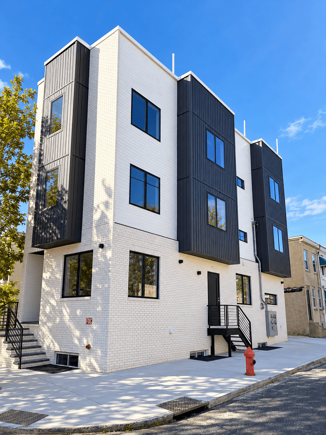 Ground-up four-unit multifamily building built by INSPO Construction & Renovations