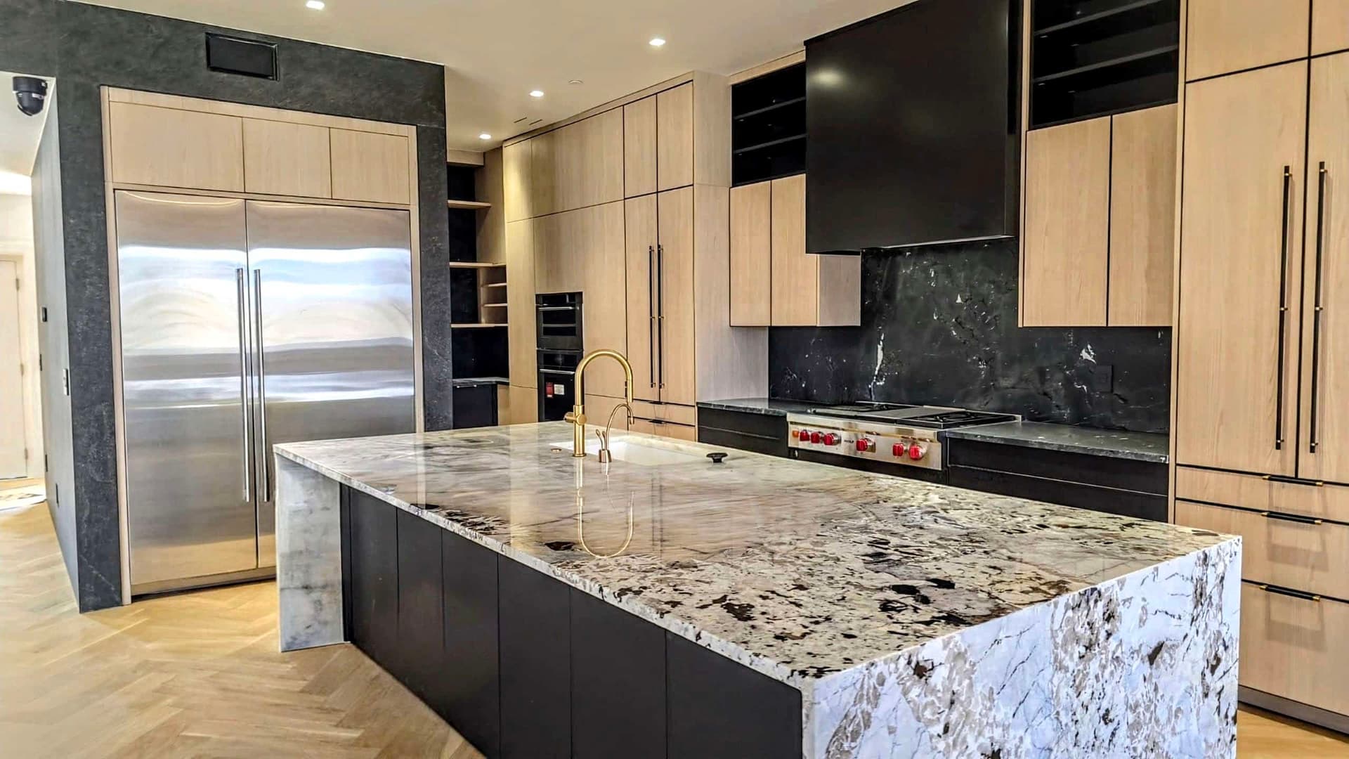 A completed high-end kitchen renovation with marble island